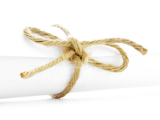 Handmade natural string knot tied on white message package isolated