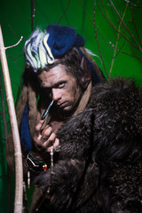 Portrait muscular werewolf with dreadlocks with long nails among