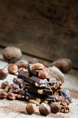 Dark chocolate with hazelnuts, walnuts, almonds, sprinkled with