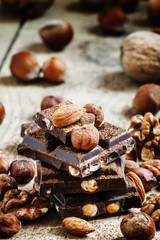 Dark chocolate with hazelnuts, walnuts, almonds, sprinkled with