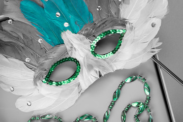 Colorful Mardi Gras mask and beads.