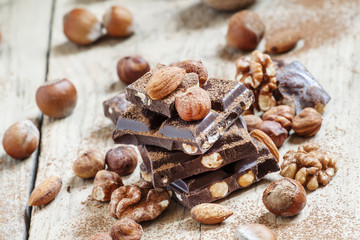 Dark chocolate with hazelnuts, walnuts, almonds, sprinkled with