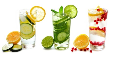 Three types of detox water with fruit in glasses isolated on a white background © Jenifoto