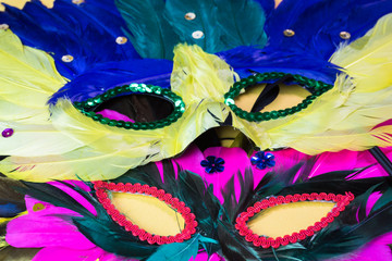 Colorful Mardi Gras mask and beads.