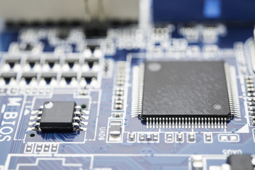 Computer chip on blue circuit motherboard