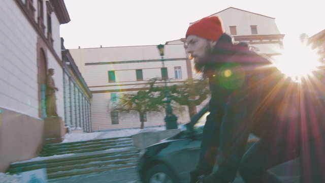 Guy riding fixed gear bike on the road in city, 4k