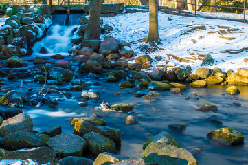 Waterfall in Oliwa Park at winter time in Gdansk, Poland