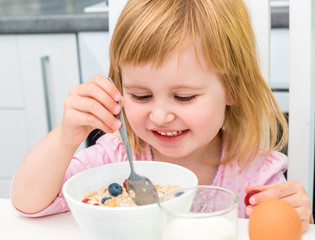 little girl having healthy breakfast