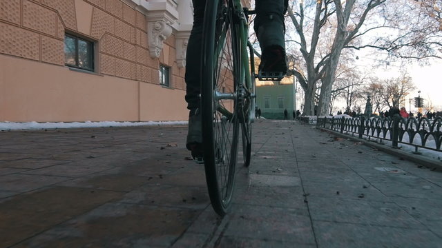 Young man riding fixed gear bike in city centre,super slow motion	