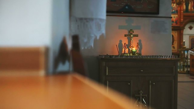 religion church burning candle on background of the cross with Jesus