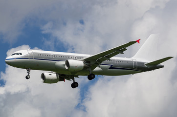 Passenger jet airplane in the sky with gear down