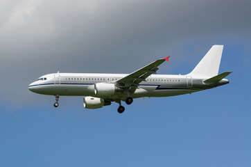 Passenger jet airplane in the sky with gear down