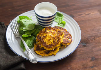 Pumpkin pancakes and fresh spinach. Healthy food