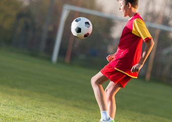Naklejka premium Child playing football