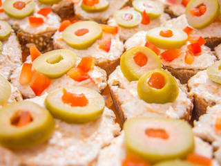 mini bruschetta with caviar and stuffed olives