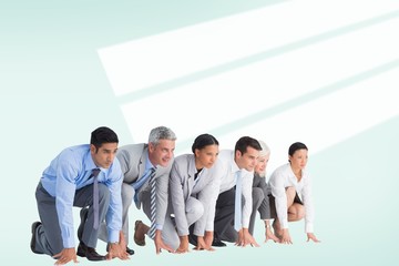 Fototapeta premium Composite image of business people preparing to run 