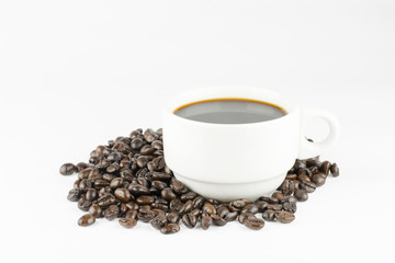 white cup with coffee beans, isolated on white background
