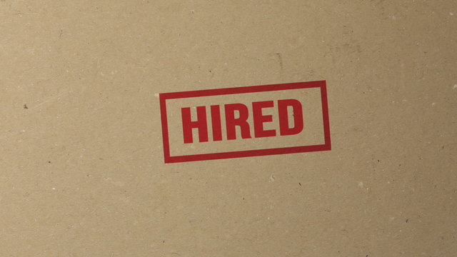 Hired red ink stamp on documents folder