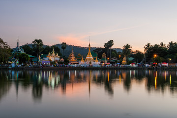 Reflection of Wat Chong Kham in the lake after sunset
