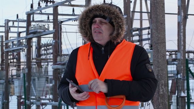Electrician used tablet PC at power plants in winter