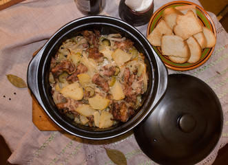 Home cooked hot meat and potatoes in the pot