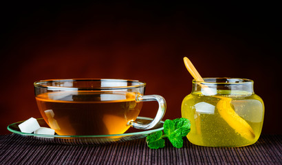 Tea Cup and Glass Of Honey