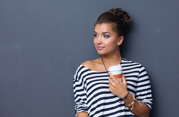 Portrait of  young woman with cup  tea or coffee
