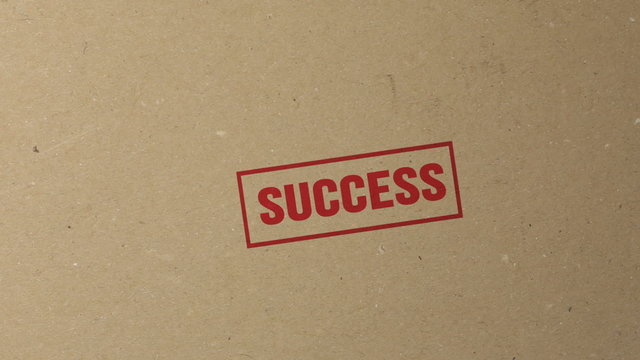 Success red ink stamp on documents folder