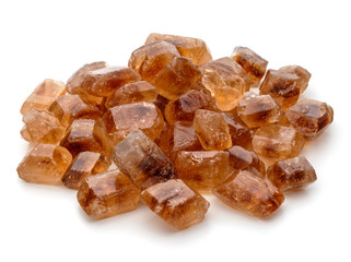 Brown caramelized lump cane sugar cube isolated on white backgro