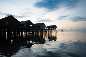 Fototapeta na wymiar Ko Panyee muslim fishing village - Huts on stilts at sunrise