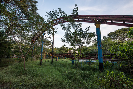 Rusty roller coaster tracks at Yangon abandoned amusement park