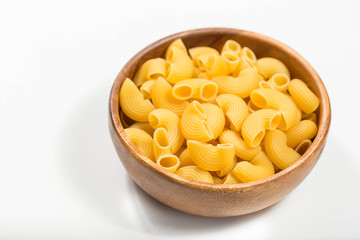 Raw uncooked pasta in bowl 