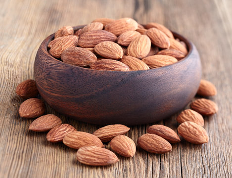 Almonds kernel on a wooden background