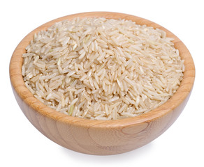 Raw brown rice in a wooden bowl isolated