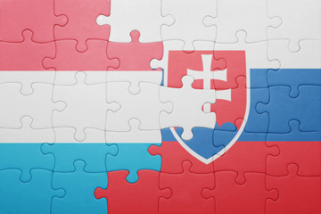 puzzle with the national flag of slovakia and luxembourg