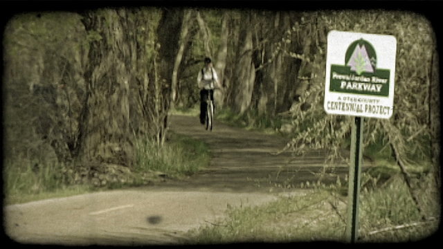 Girl rides bike 1. Vintage stylized video clip.