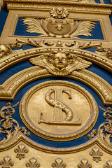 Fototapeta na wymiar Heraldic motifs on front door to Les Invalides. Paris, France