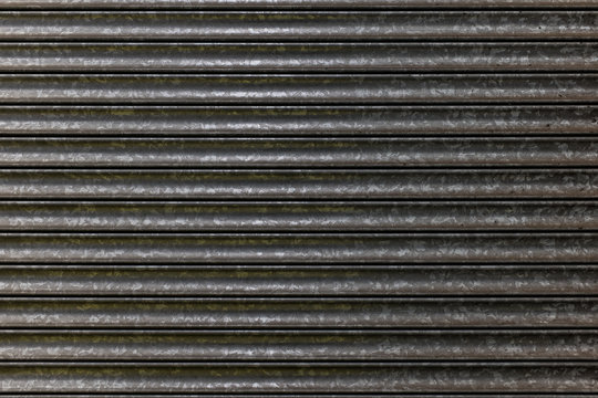 Metal shutters protecting shop frontage