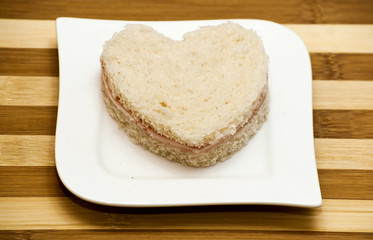 Love sandwich on a wooden background