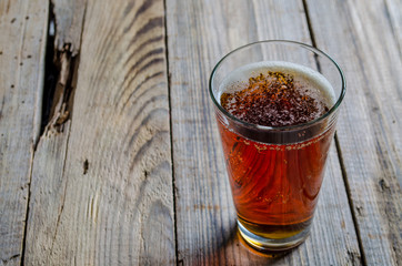 glass of beer shot top down on wooden rustic table