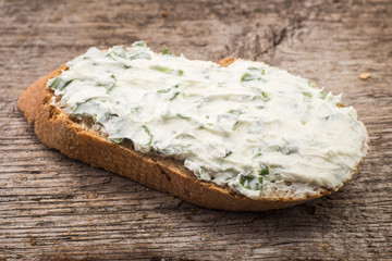 Small sandwich with creamy cheese on sliced bread