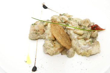 mushrooms in a cream sauce with steamed vegetables on a white background in the restaurant