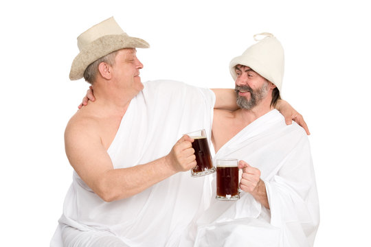 Men in traditional bathing costumes drink kvas - bread drink. From a series of Russian bath.