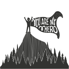 Man in cloak on top of the mountain peak. You are my hero. Typography poster