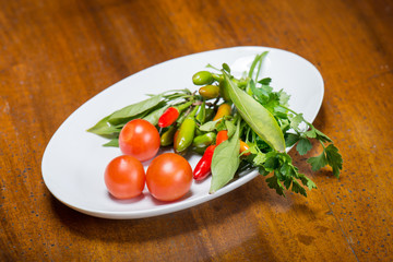 Tomatoes and hot peppers with parsley fresh from the garden
