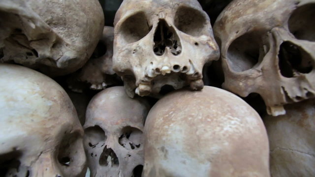 Skulls and bones in Killing field, cambodia, moving camera