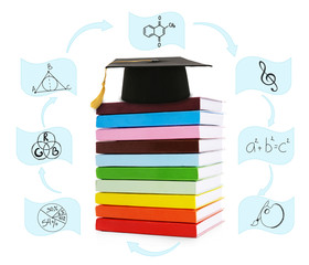 Pile of books with grad hat and vector images, isolated on white