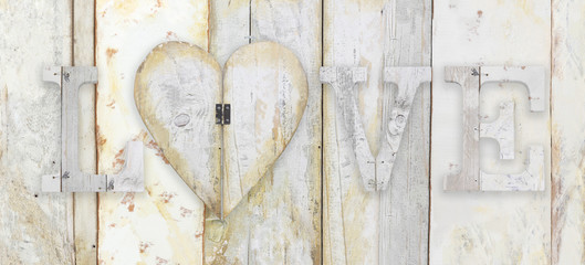 love text with heart shape on wood planks grunge texture backgro