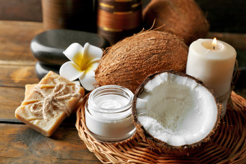 Spa coconut products on dark wooden background