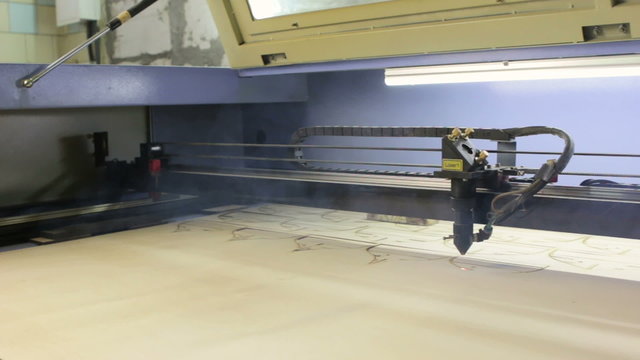 Laser cutting machine at work.  Cuting patterns for ship model